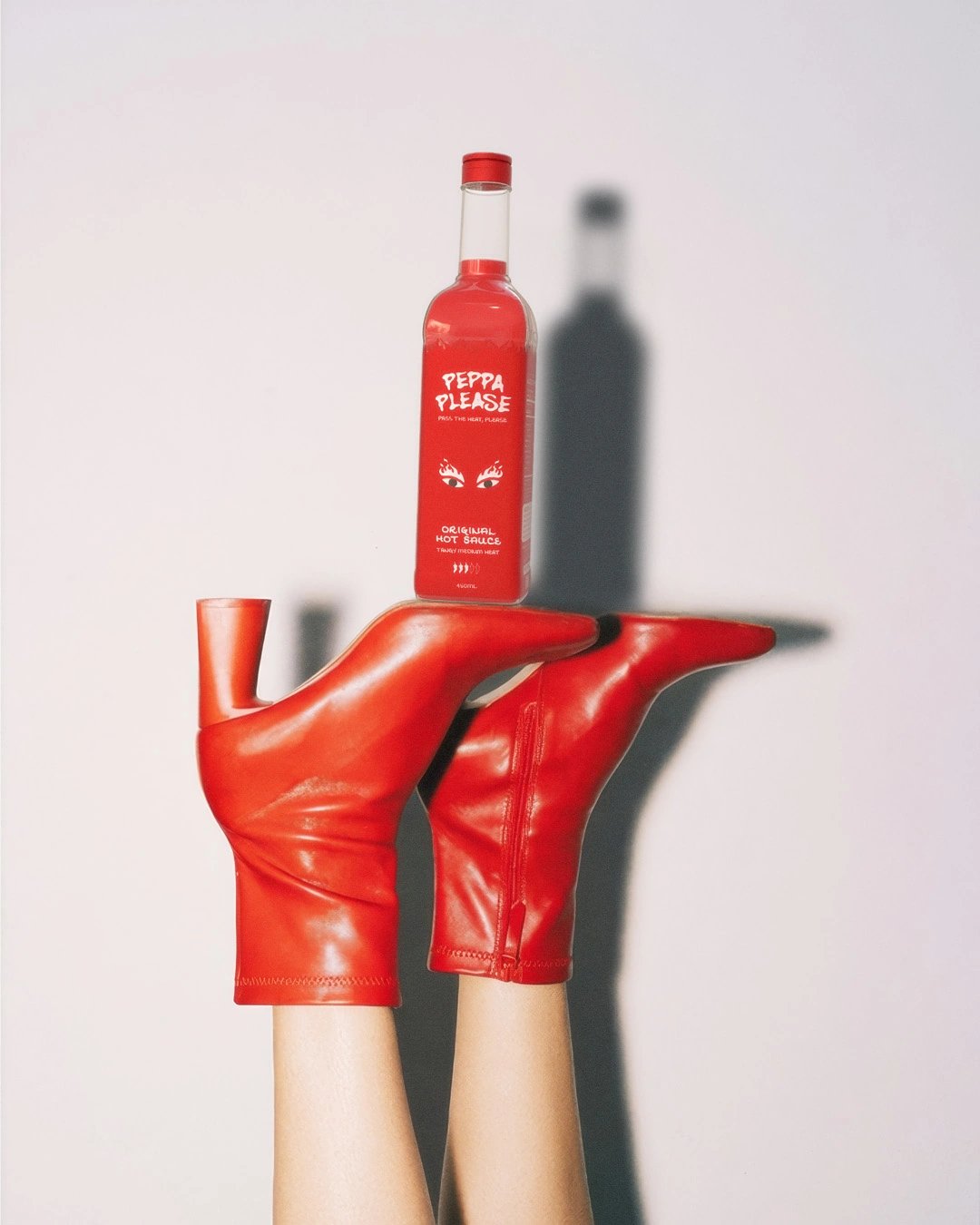 Peppa Please Bottle Balanced On Heels