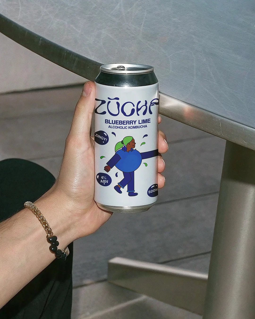 ZŪCHA Blueberry Lime Can Held In Hand