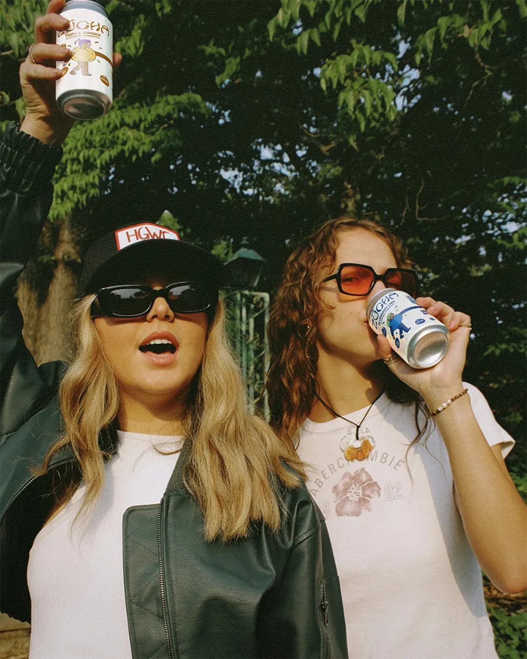 Two people drinking Zucha Kombucha at a gathering